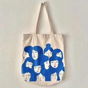 Women faces tote bag